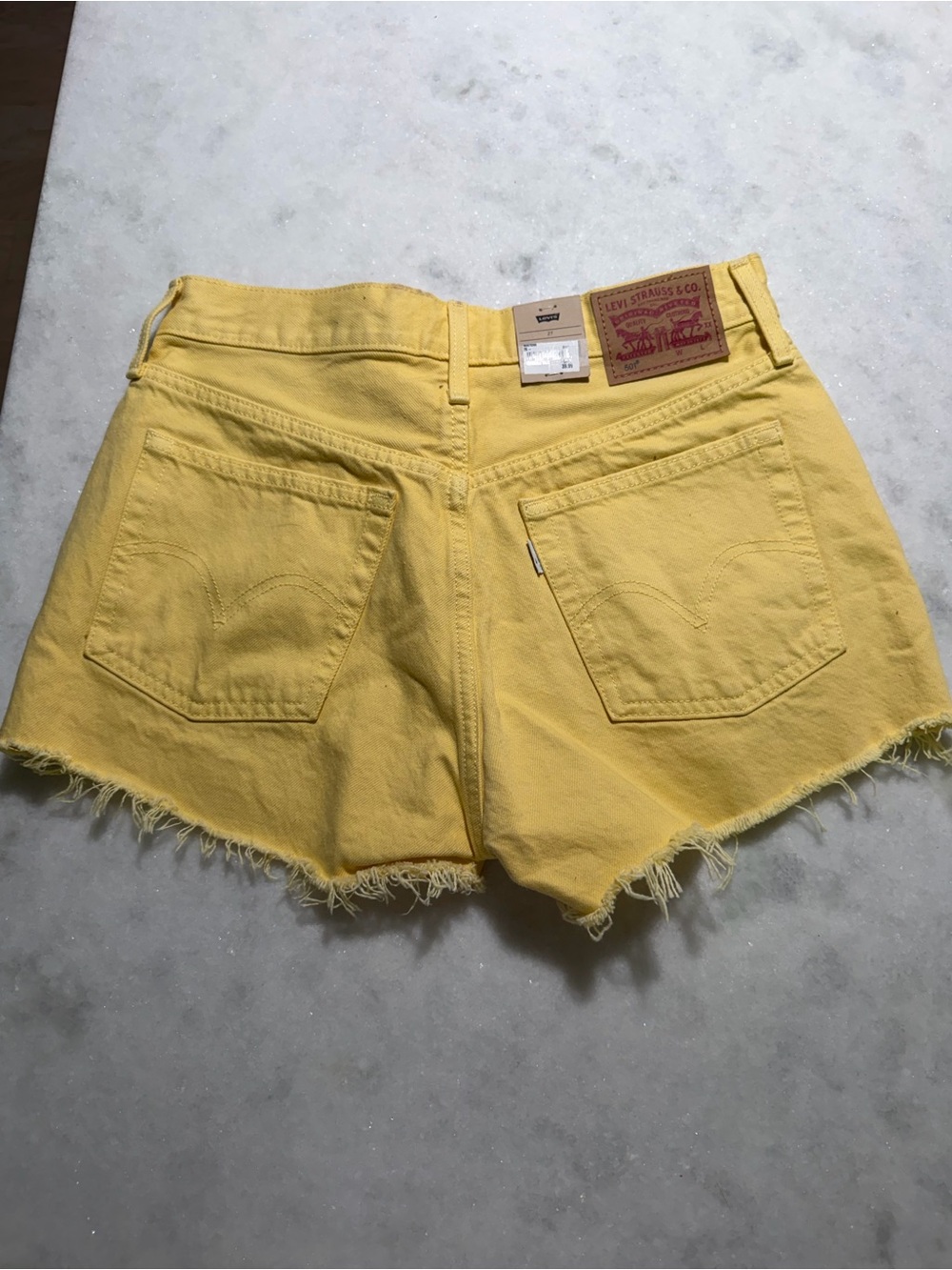 Levi's Yellow High-Rise Raw Hem Denim Shorts - Picture 2 of 6